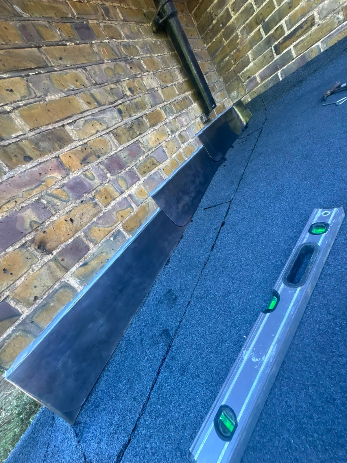 Finished lead flashing and lead valley work on a slate roof