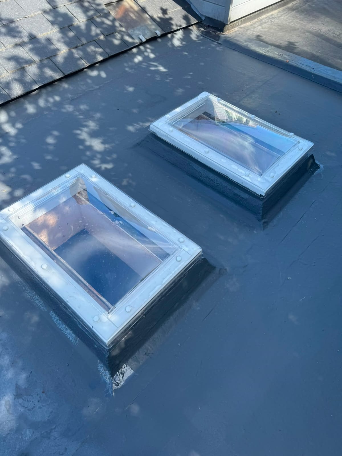 Close-up of a new rooflight installed in a fibreglass flat roof