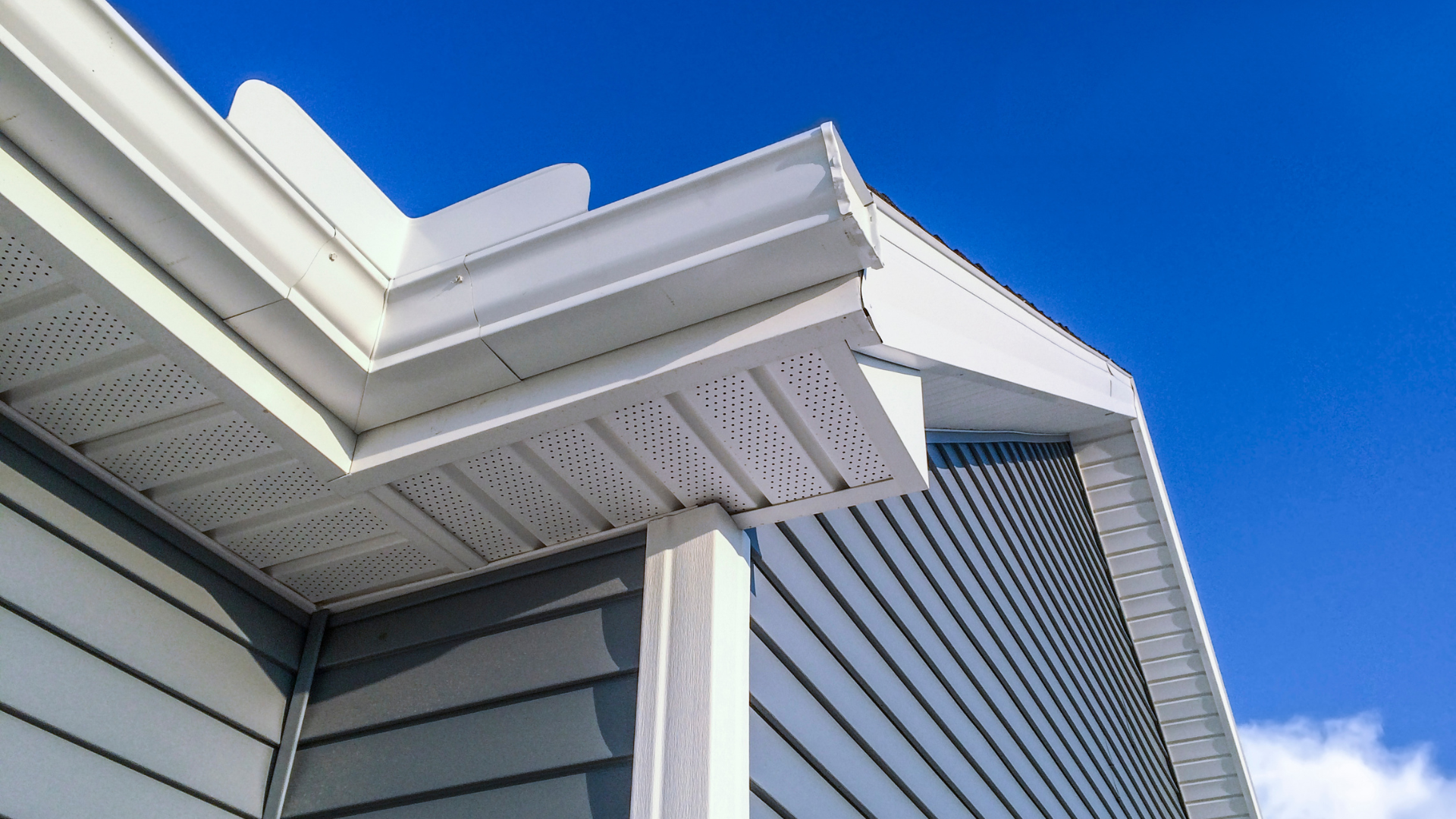 New white uPVC fascia board and vented soffit fitted under the eaves