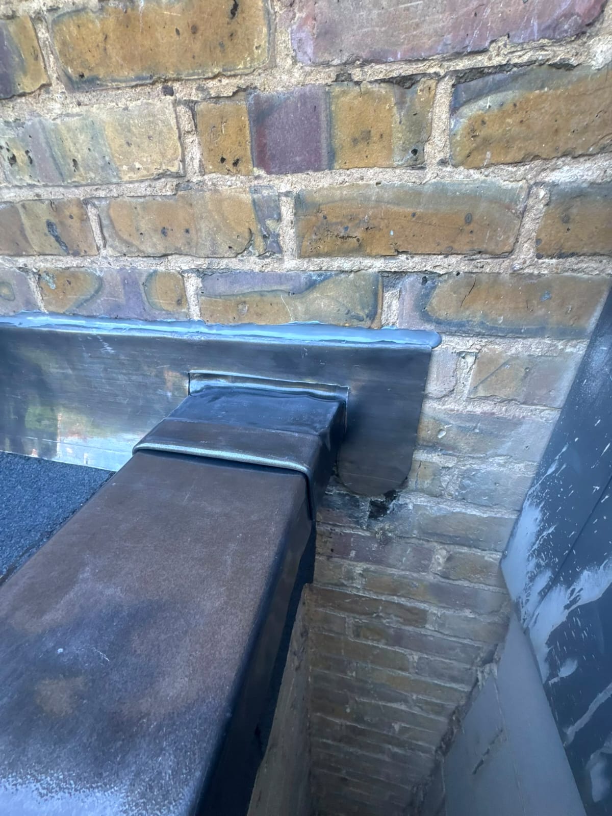 Finished lead flashing and lead valley work on a slate roof
